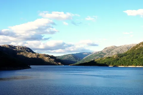 Mountain reservoir surrounded by green peaks in Peneda-Geres National Park, Portugal