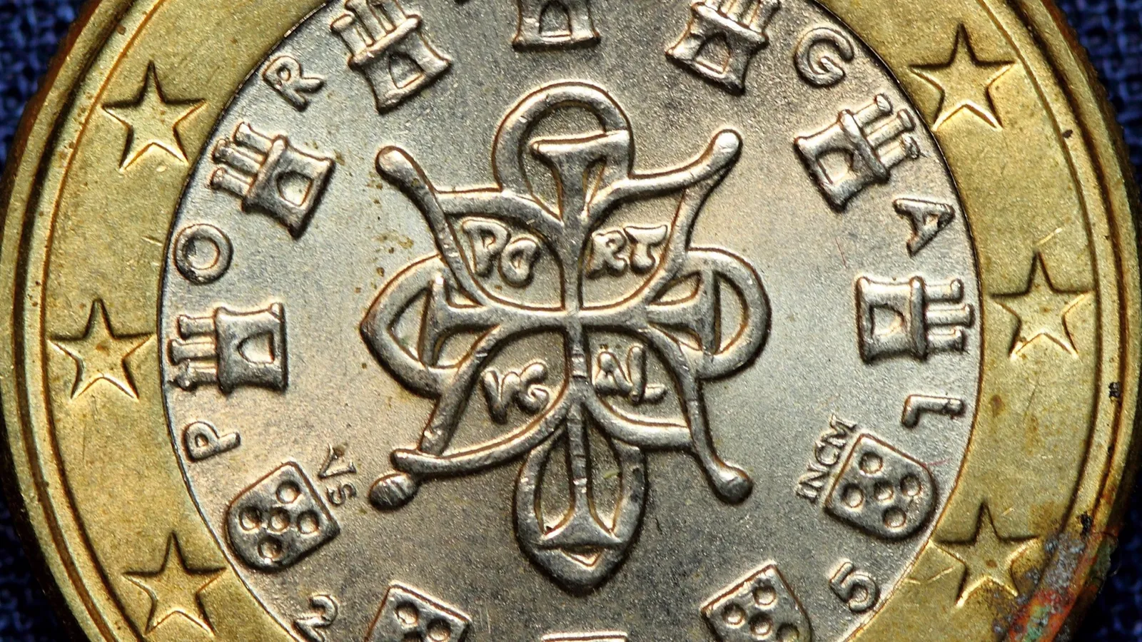 Close-up of a Portuguese 1 euro coin, representing tax and finance topics for US expats