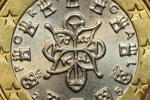 Close-up of a Portuguese 1 euro coin, representing tax and finance topics for US expats