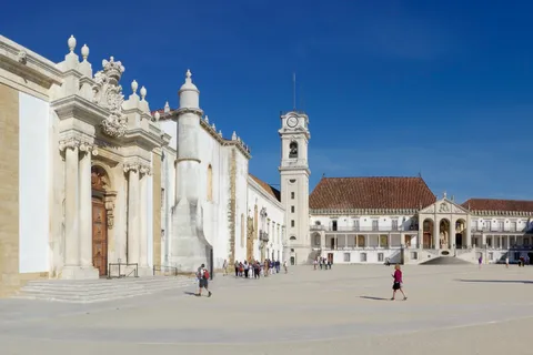 University of Coimbra's historic square and clock tower, a classic Portuguese city landmark