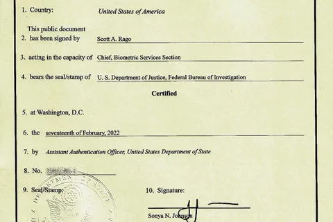 A US Department of State apostille certificate attached to an FBI background check, with the embossed seal and the Hague Convention heading