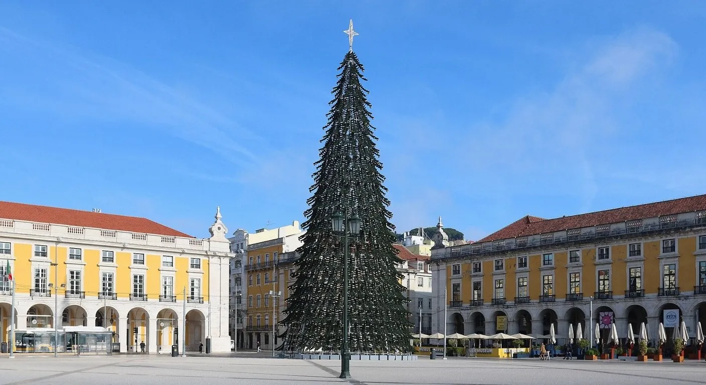 Giant Christmas tree in Praca do Comercio, Lisbon, under a clear blue December sky