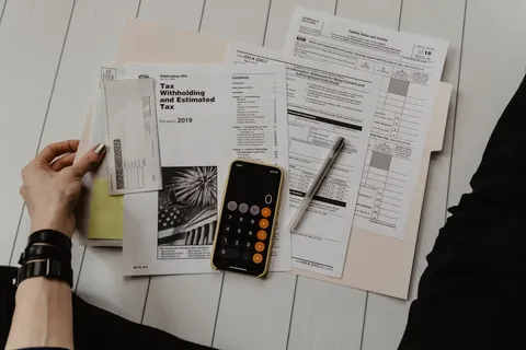 Tax documents and calculator on a desk — Portugal tax guide for expats 2026