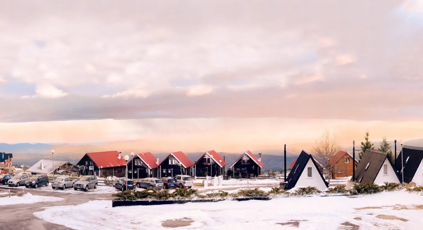 Snow-covered chalets at Penhas da Saude in the Serra da Estrela mountains, Portugal, at sunset