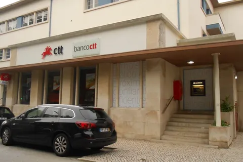 Banco CTT branch storefront with a Multibanco ATM in Figueira da Foz, Portugal