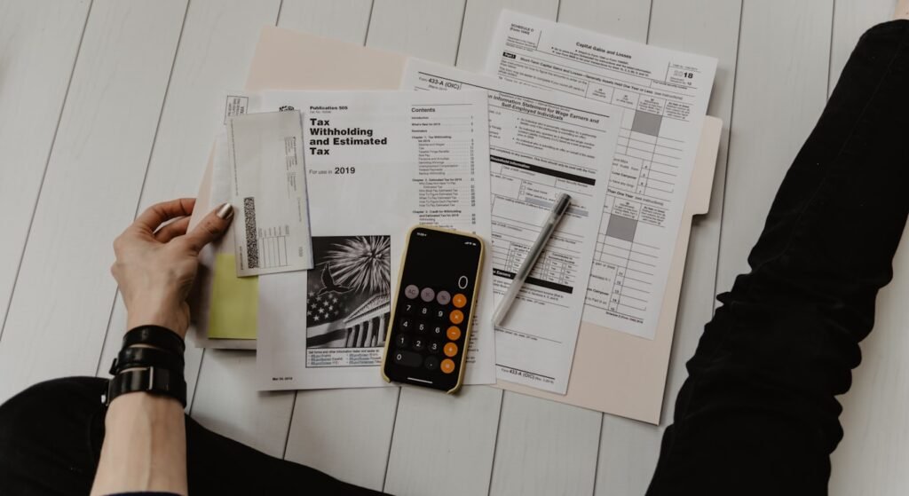 Tax documents and calculator on a desk — Portugal tax guide for expats 2026