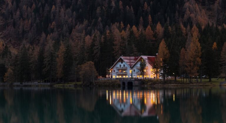 Moody lakeside evening with autumn trees — Portugal in winter travel guide