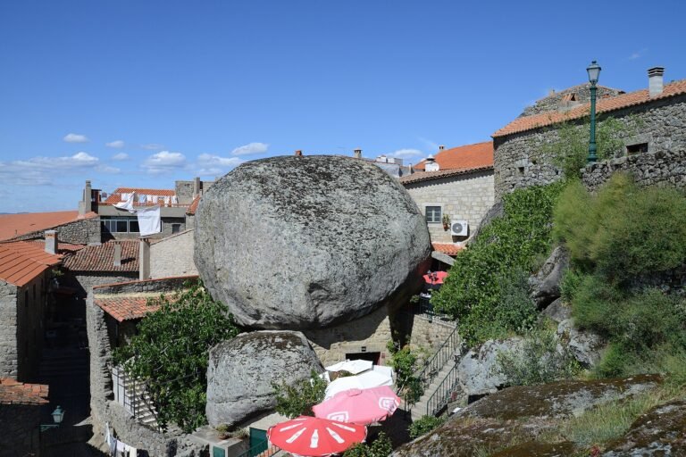 Granite boulder wedged between stone houses in Monsanto, one of the historic villages of Portugal