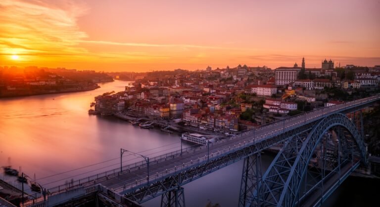 Porto and the Dom Luis I bridge over the Douro at sunset, start of a north Portugal road trip