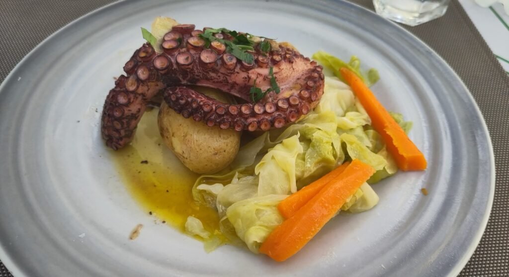 Polvo a lagareiro, grilled octopus with olive oil and punched potato, a classic Portuguese food dish