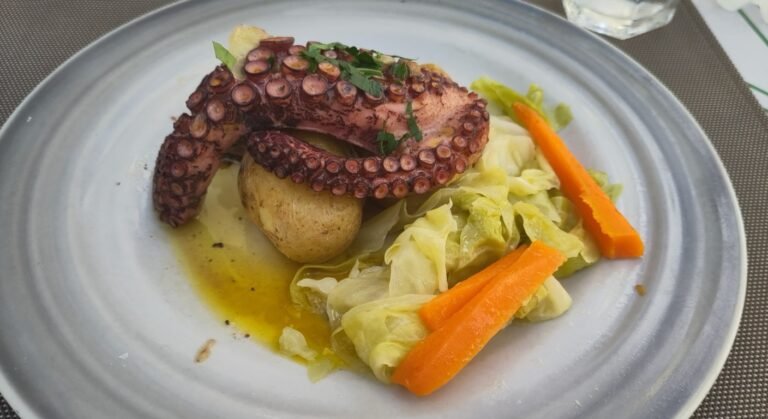 Polvo a lagareiro, grilled octopus with olive oil and punched potato, a classic Portuguese food dish