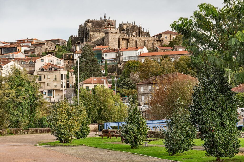 Tui cathedral fortress above the old town in Galicia, seen from the Minho river near Valenca Portugal